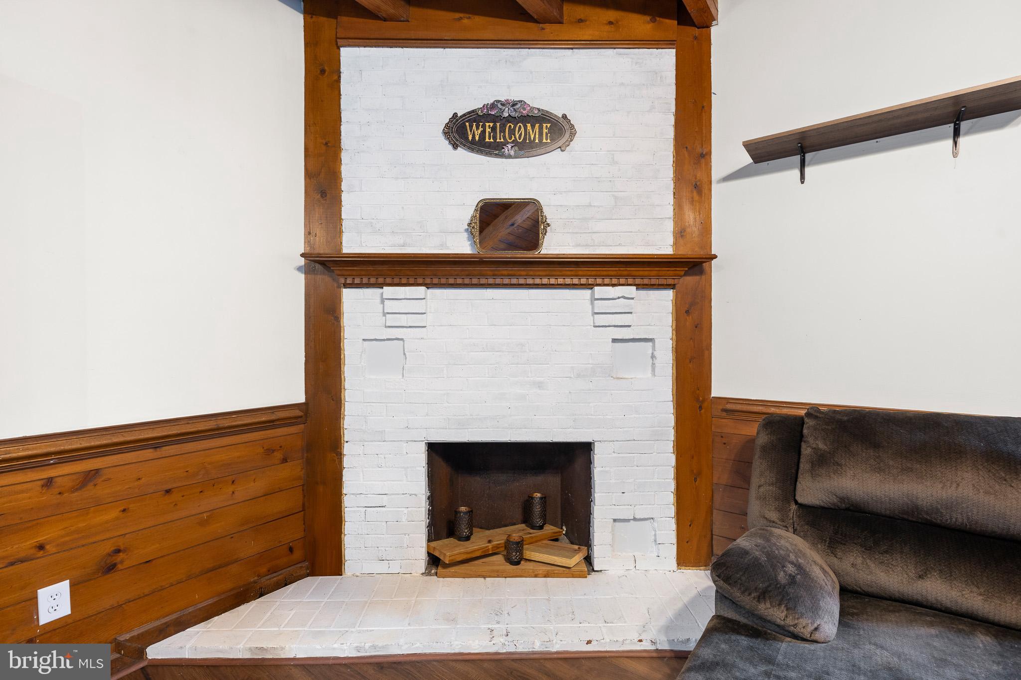 5708 Lakeview Road Quinton, VA 23141 - Photo 11 of 53 a living room with furniture and a fireplace