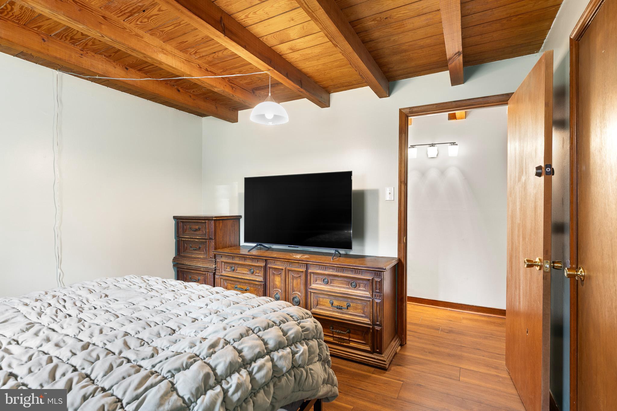 5708 Lakeview Road Quinton, VA 23141 - Photo 18 of 53 a bedroom with a bed and a flat screen tv