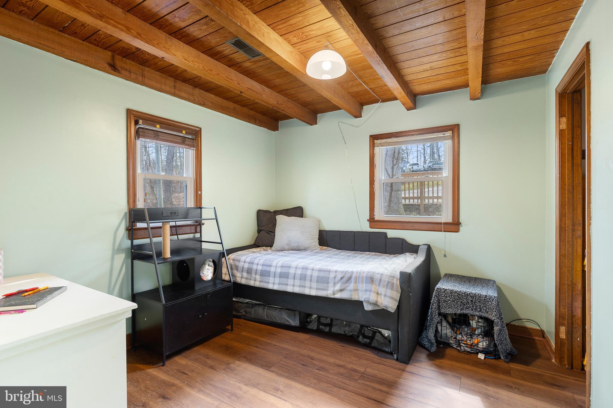 5708 Lakeview Road Quinton, VA 23141 - Photo 19 of 53 a bedroom with a bed and a table