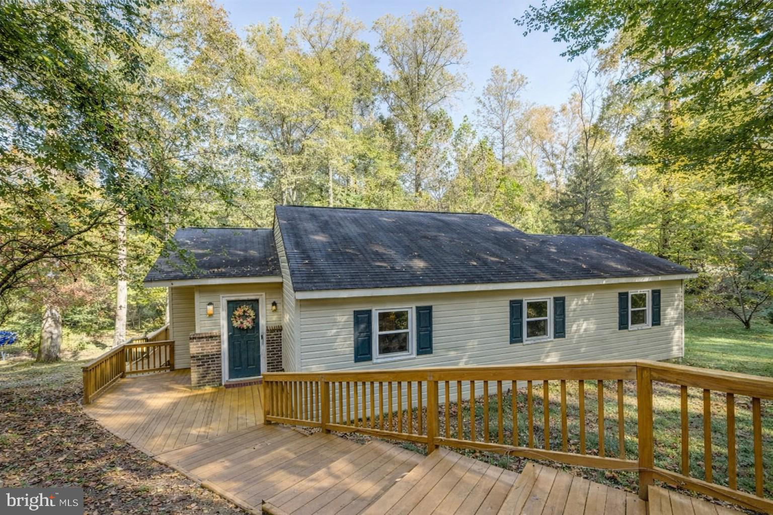 5708 Lakeview Road Quinton, VA 23141 - Photo 3 of 53 a view of a house with a wooden fence