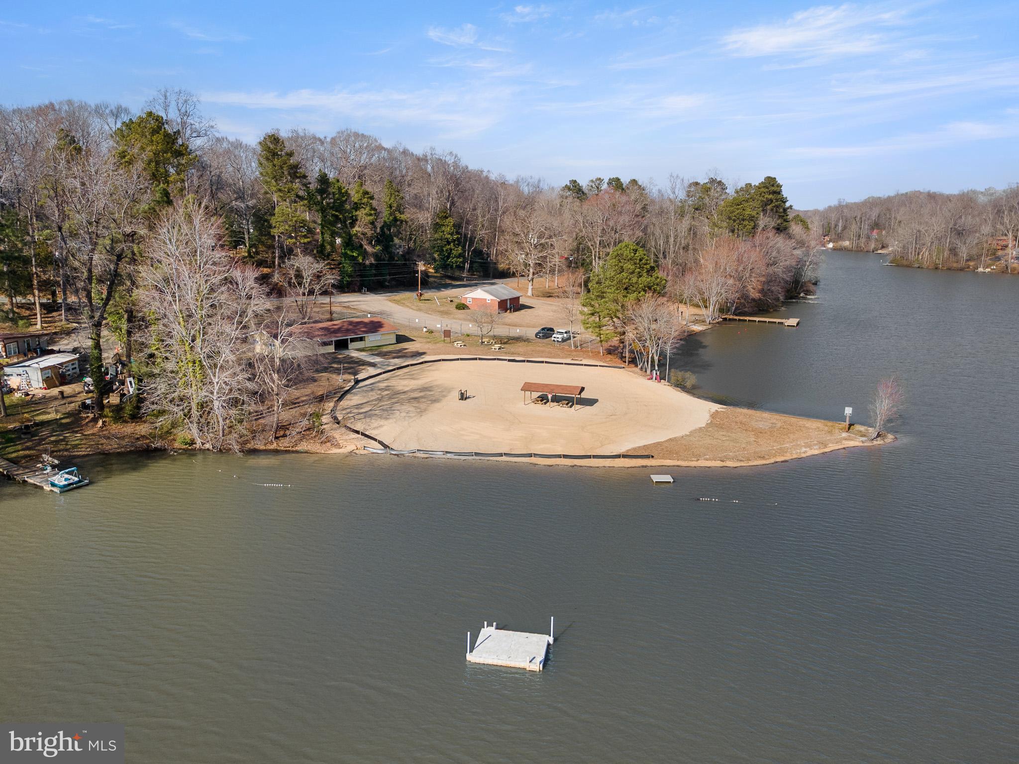 5708 Lakeview Road Quinton, VA 23141 - Photo 33 of 53 a view of a house next to a lake with a city