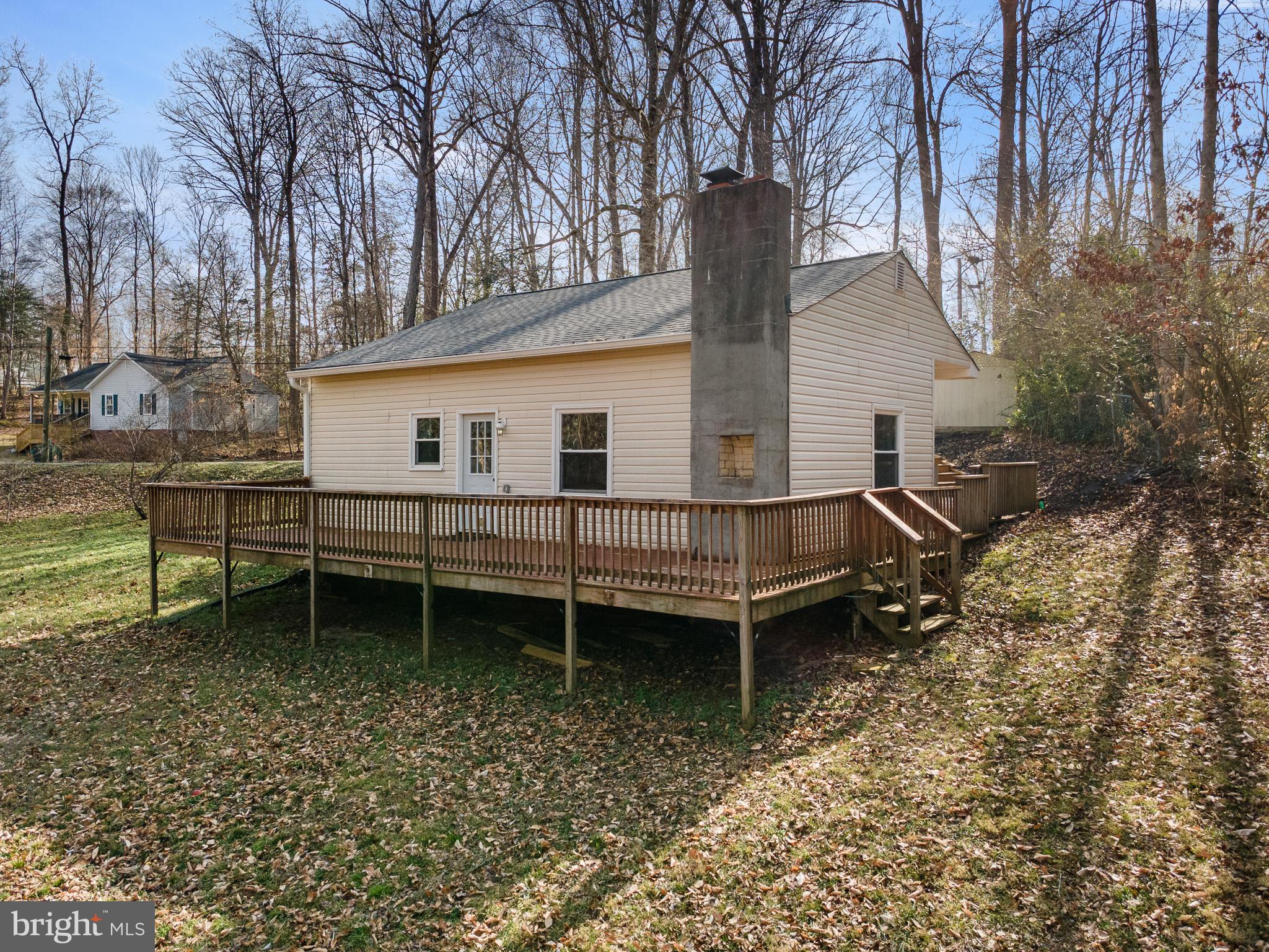 5708 Lakeview Road Quinton, VA 23141 - Photo 38 of 53 a view of a house with a yard and wooden deck