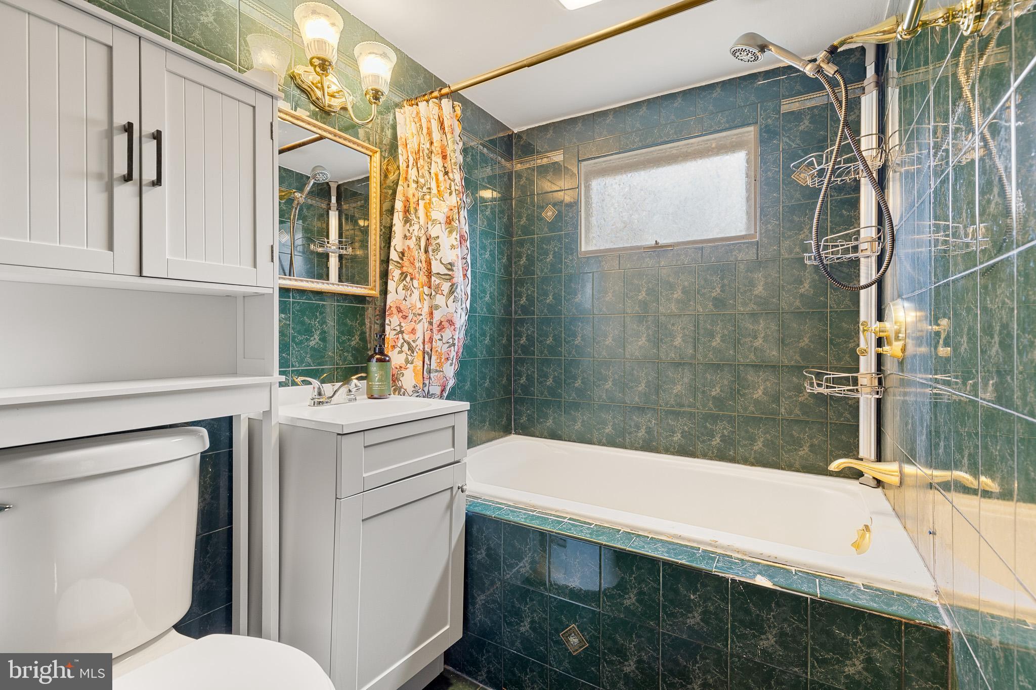 5708 Lakeview Road Quinton, VA 23141 - Photo 43 of 53 a bathroom with a sink a toilet and shower