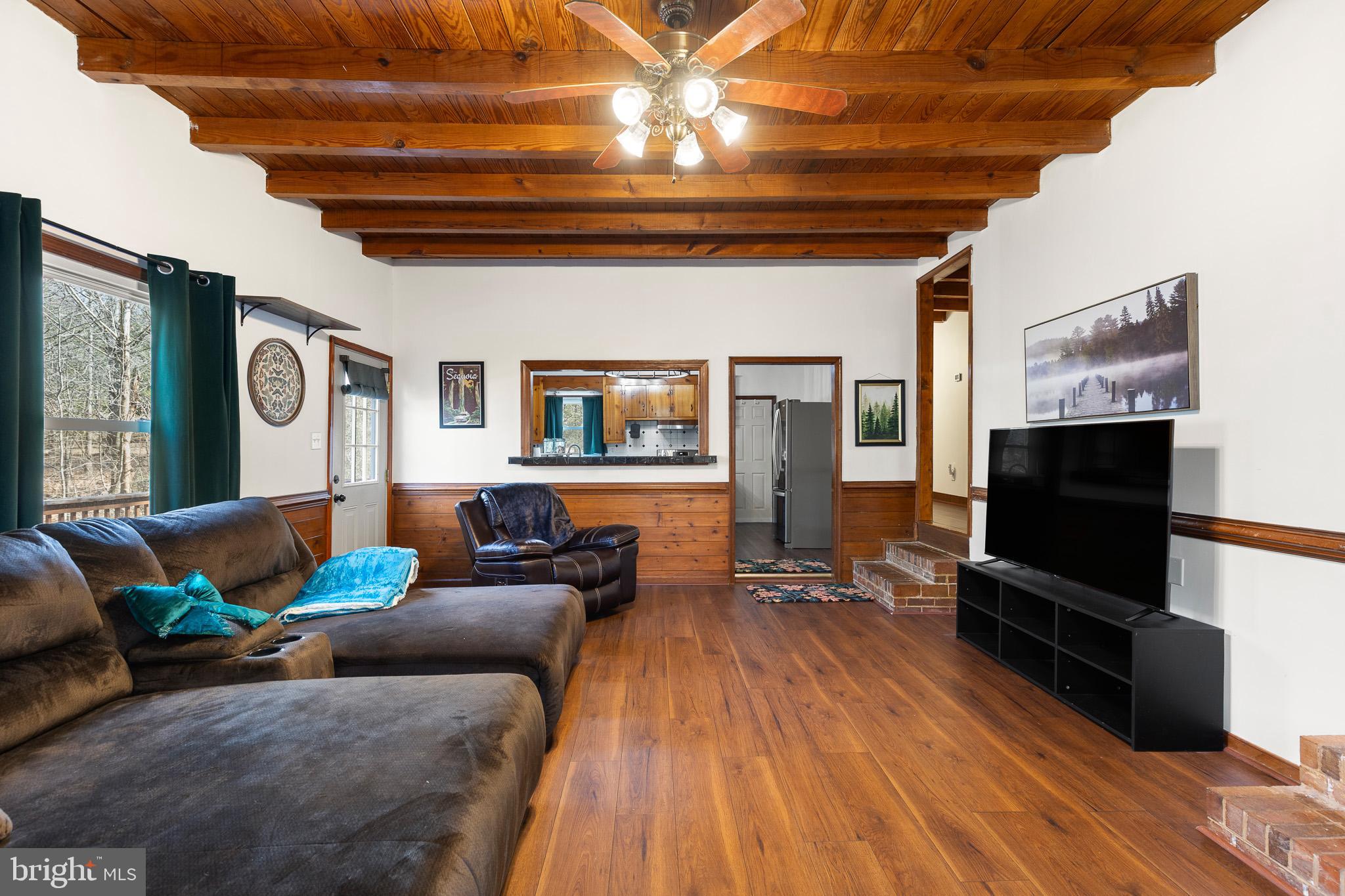 5708 Lakeview Road Quinton, VA 23141 - Photo 6 of 53 a living room with furniture and a flat screen tv