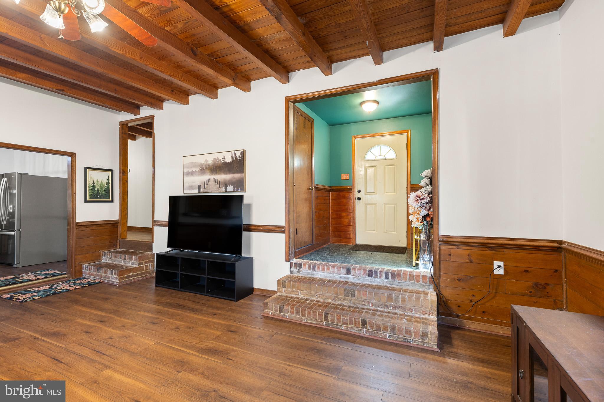 5708 Lakeview Road Quinton, VA 23141 - Photo 9 of 53 a view of a livingroom with furniture and a flat screen tv