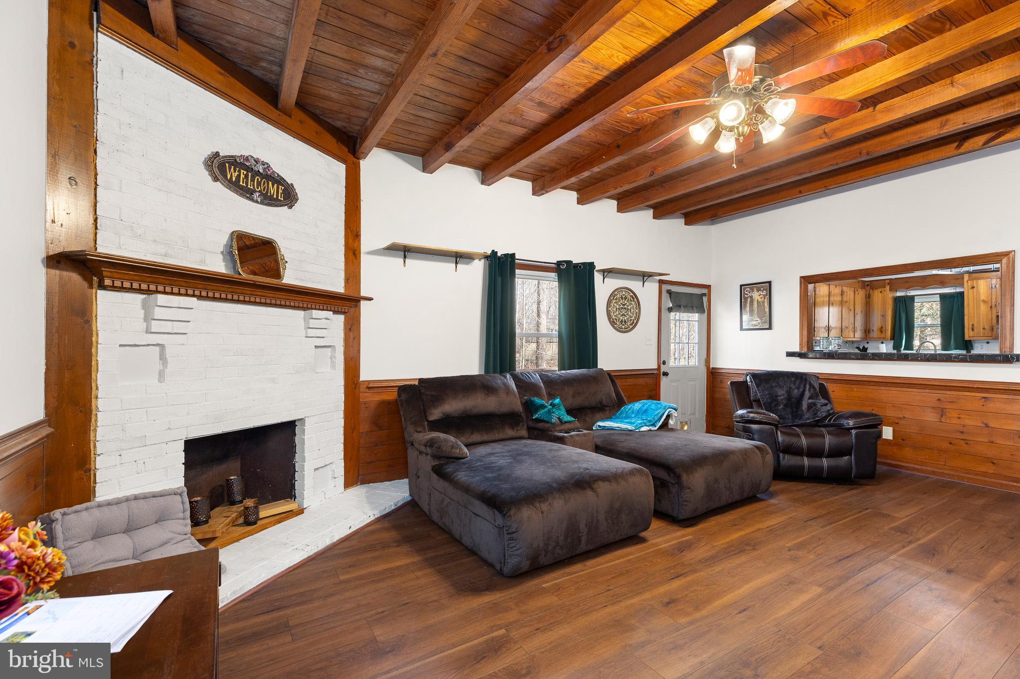 5708 Lakeview Road Quinton, VA 23141 - Photo 10 of 53 a living room with furniture and a fireplace