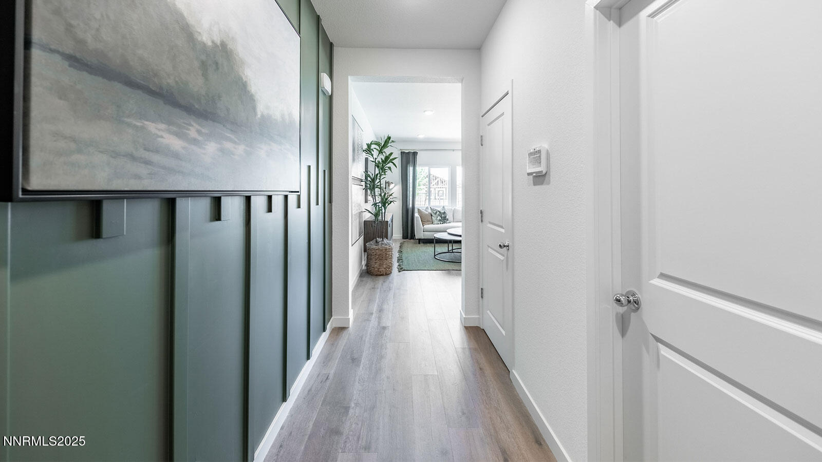 7559 Editor Drive Reno, NV 89506 - Photo 2 of 22 a view of a hallway with wooden floor and staircase