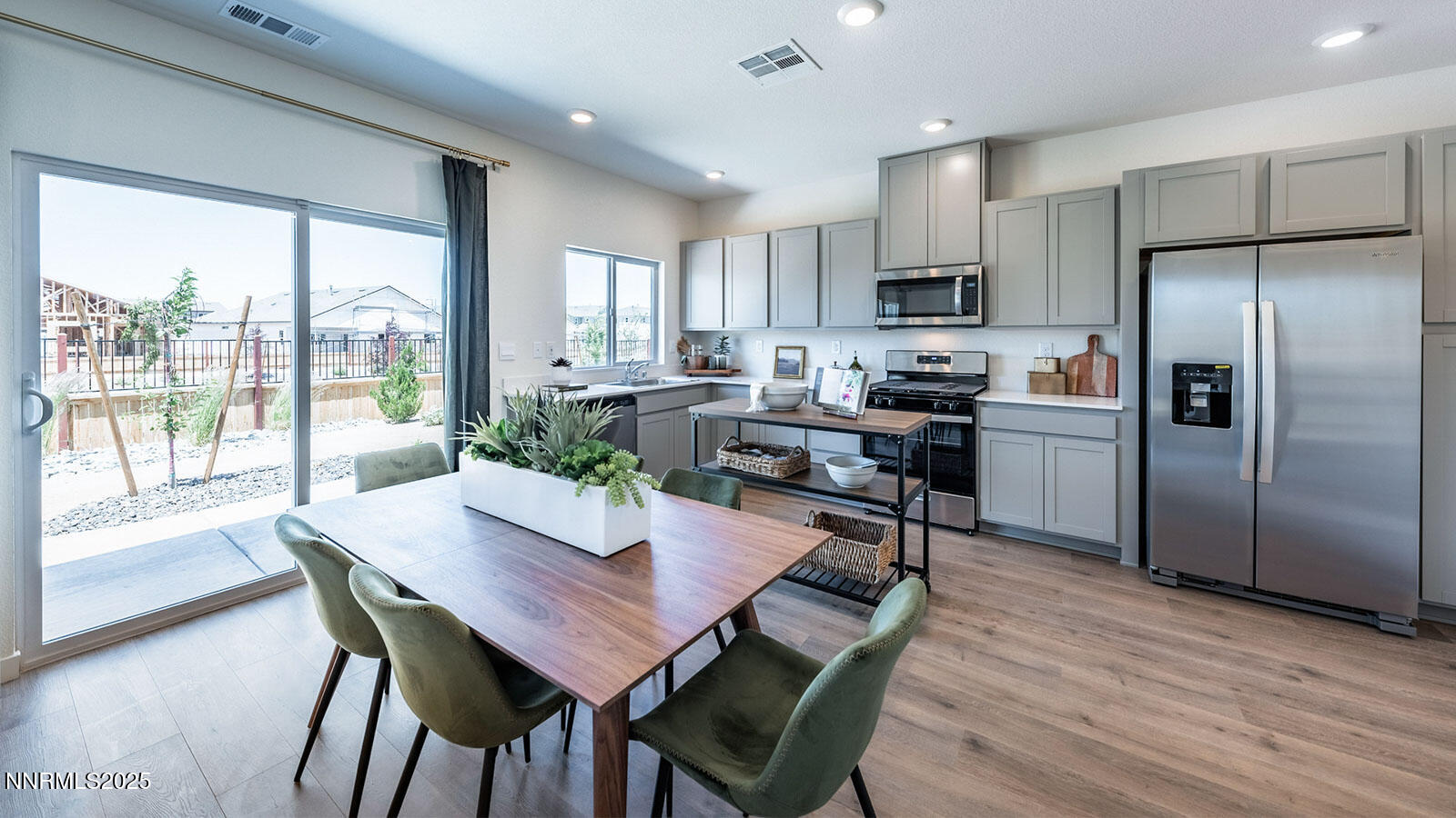 7559 Editor Drive Reno, NV 89506 - Photo 8 of 22 a view of a dining room with furniture window and wooden floor