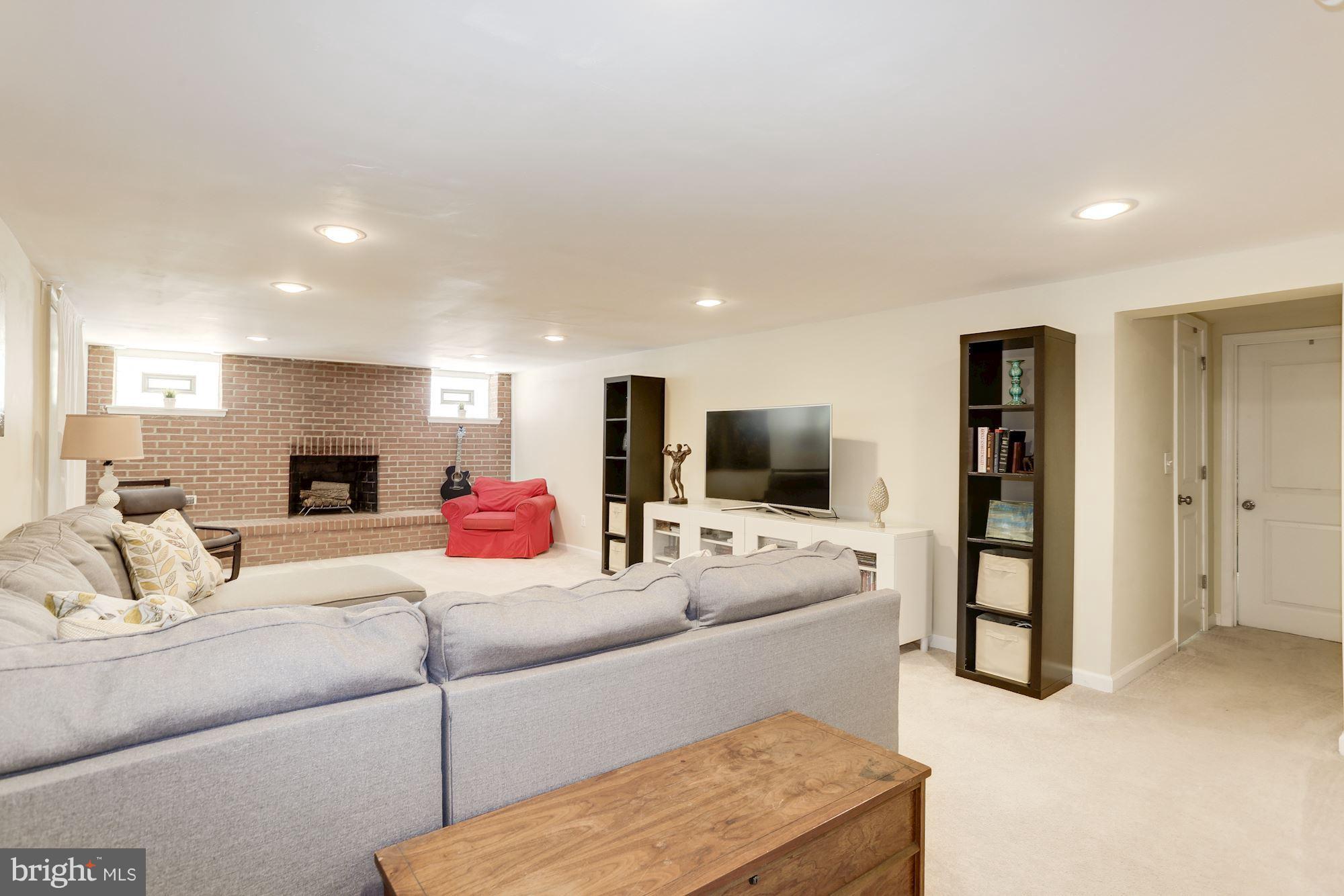 5404 Lightning View Road Columbia, MD 21045 - Photo 22 of 30 Huge lower level family room with fireplace