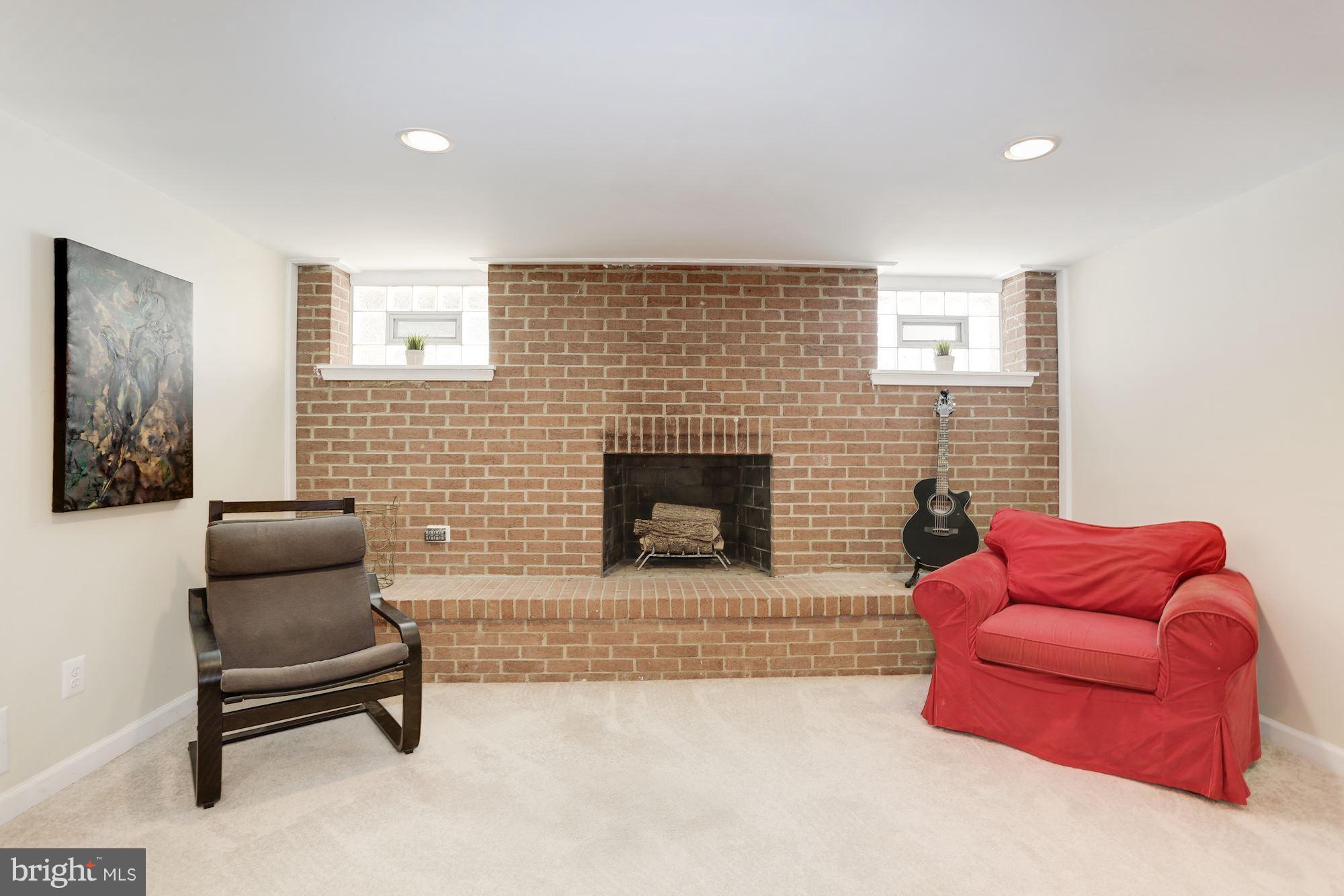 5404 Lightning View Road Columbia, MD 21045 - Photo 24 of 30 Beautiful brick wall surounds cozy WB fireplace
