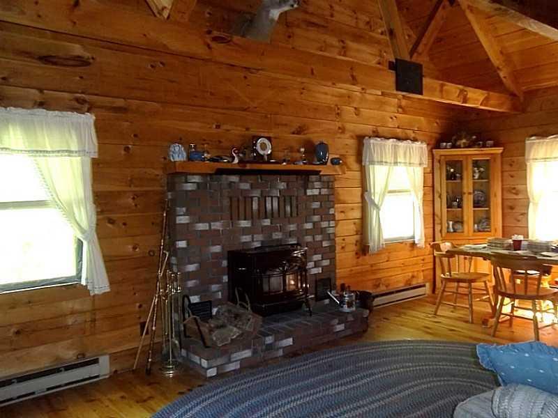 176 Stephens Road Oquossoc, ME 04964 - Photo 6 of 30 Living Room. Front living room has...