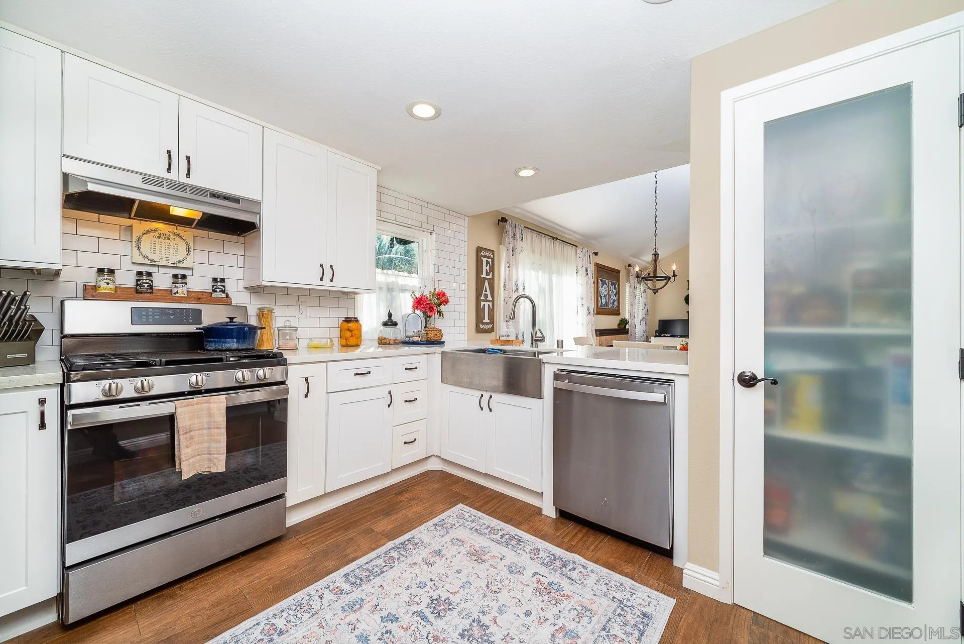 325 Wind Flower Way Oceanside, CA 92057 - Photo 13 of 41 a kitchen with a stove oven and sink