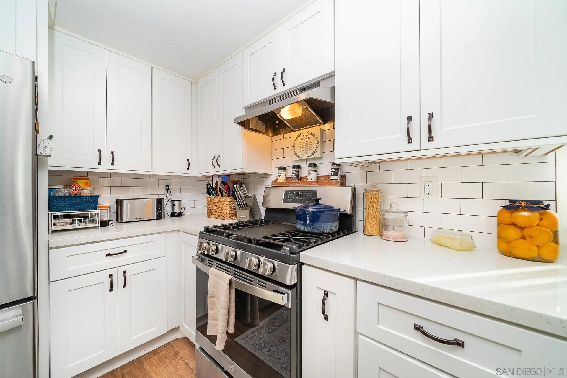 325 Wind Flower Way Oceanside, CA 92057 - Photo 15 of 41 a kitchen with appliances cabinets and a stove top oven