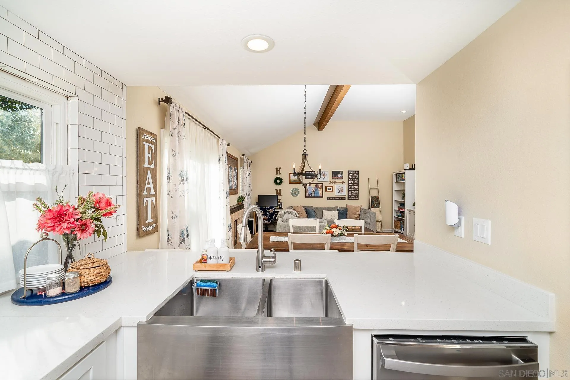 325 Wind Flower Way Oceanside, CA 92057 - Photo 16 of 41 a kitchen with kitchen island a sink and a stove