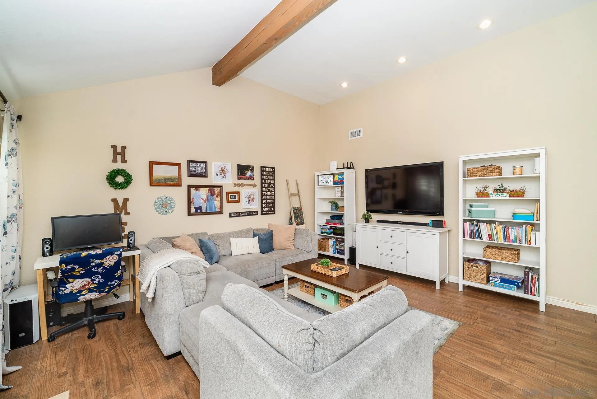 325 Wind Flower Way Oceanside, CA 92057 - Photo 18 of 41 a living room with furniture and a flat screen tv