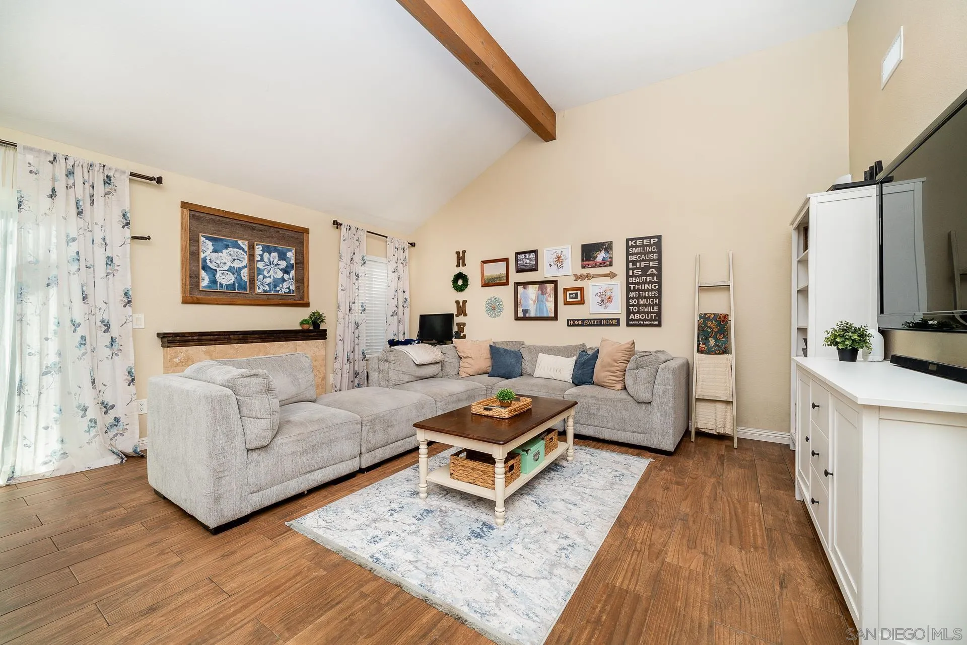 325 Wind Flower Way Oceanside, CA 92057 - Photo 19 of 41 a living room with furniture and a flat screen tv