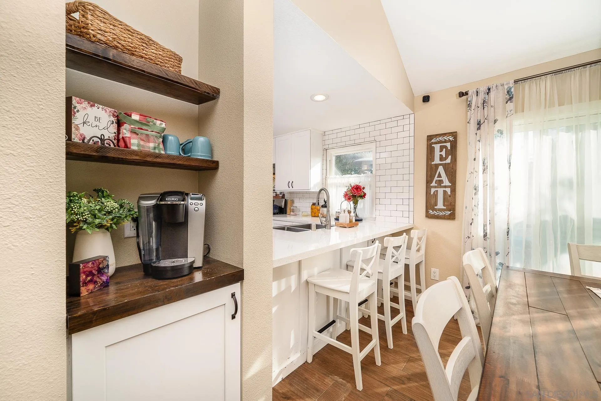 325 Wind Flower Way Oceanside, CA 92057 - Photo 21 of 41 a kitchen with stainless steel appliances kitchen island granite countertop a refrigerator and microwave
