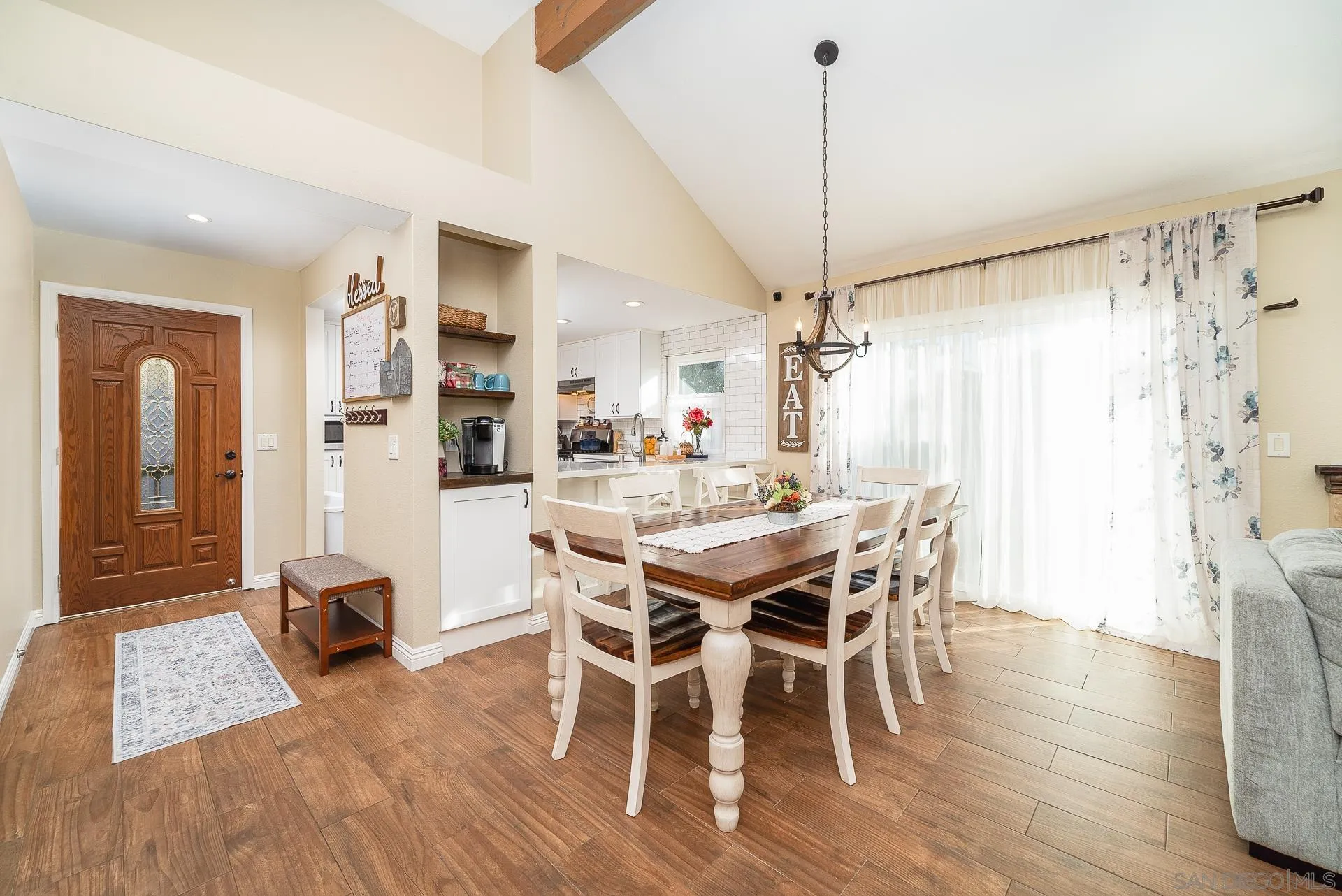 325 Wind Flower Way Oceanside, CA 92057 - Photo 22 of 41 a dining room with furniture and wooden floor