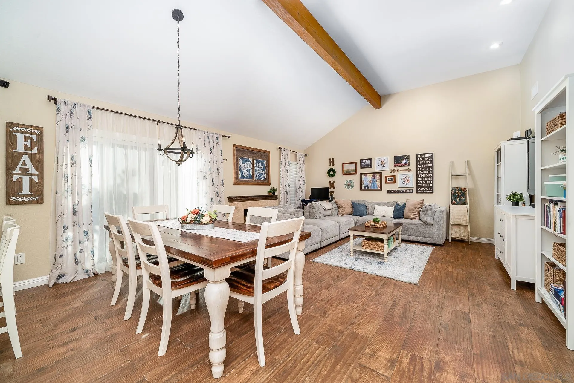 325 Wind Flower Way Oceanside, CA 92057 - Photo 23 of 41 a view of a dining room with furniture and wooden floor