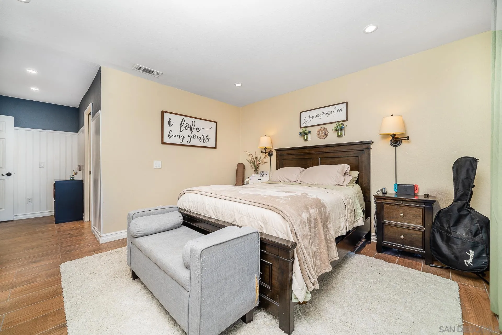 325 Wind Flower Way Oceanside, CA 92057 - Photo 26 of 41 a bedroom with a bed and a couch