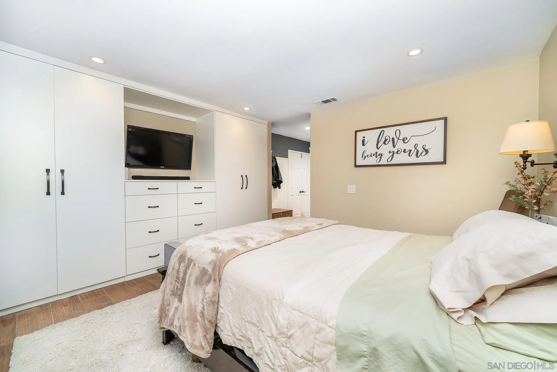 325 Wind Flower Way Oceanside, CA 92057 - Photo 28 of 41 a bedroom with a bed and a flat screen tv