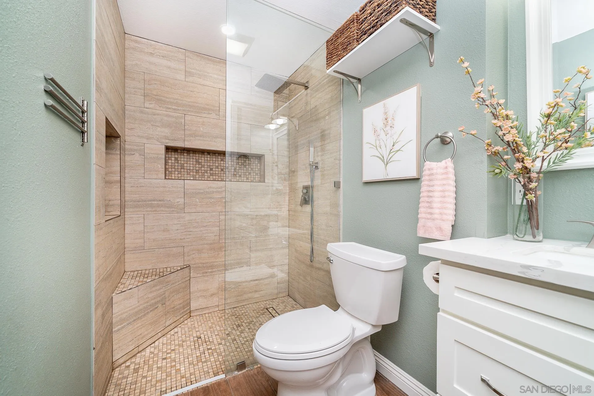 325 Wind Flower Way Oceanside, CA 92057 - Photo 34 of 41 a bathroom with a granite countertop toilet a sink and a shower