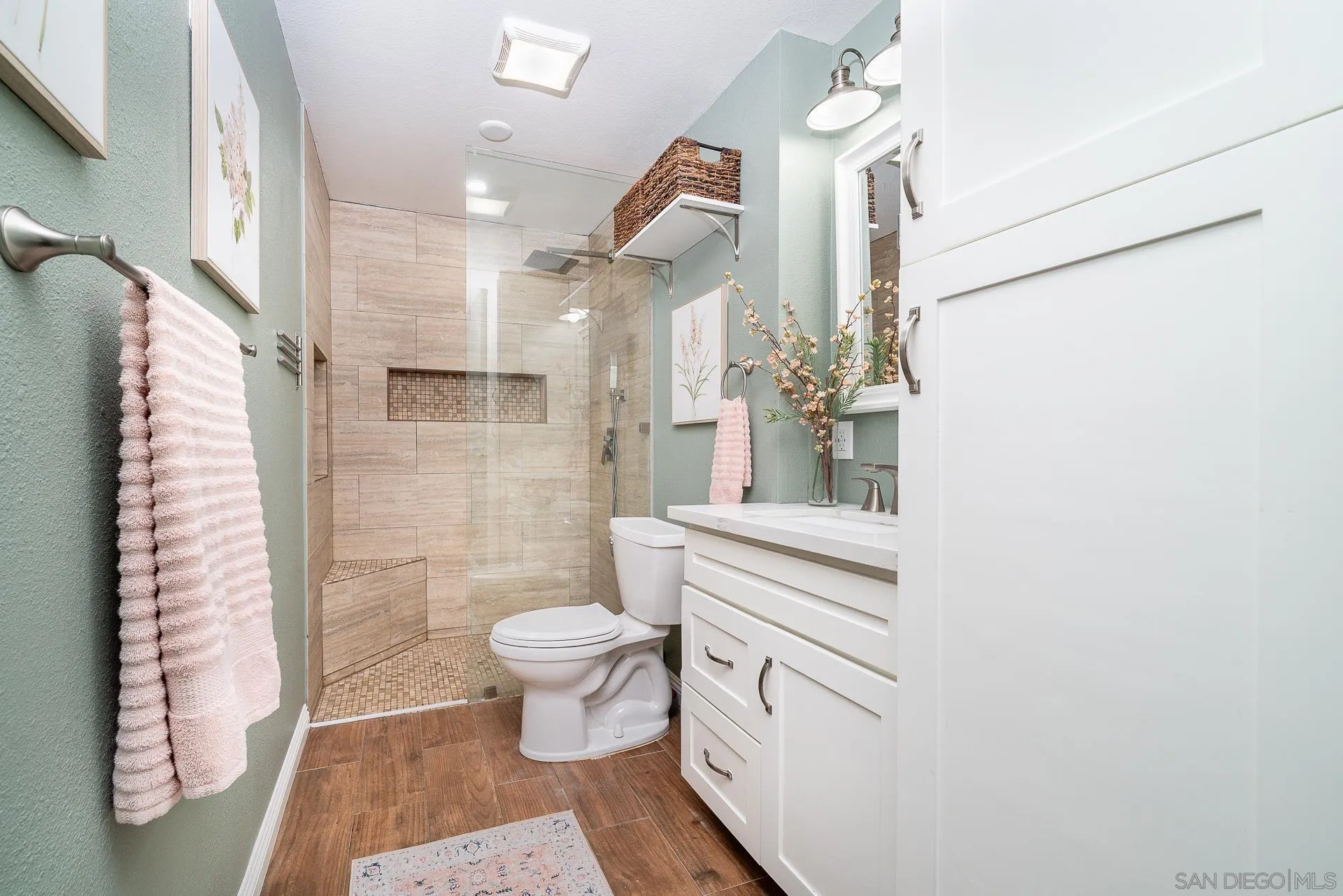 325 Wind Flower Way Oceanside, CA 92057 - Photo 36 of 41 a bathroom with a sink a toilet and shower