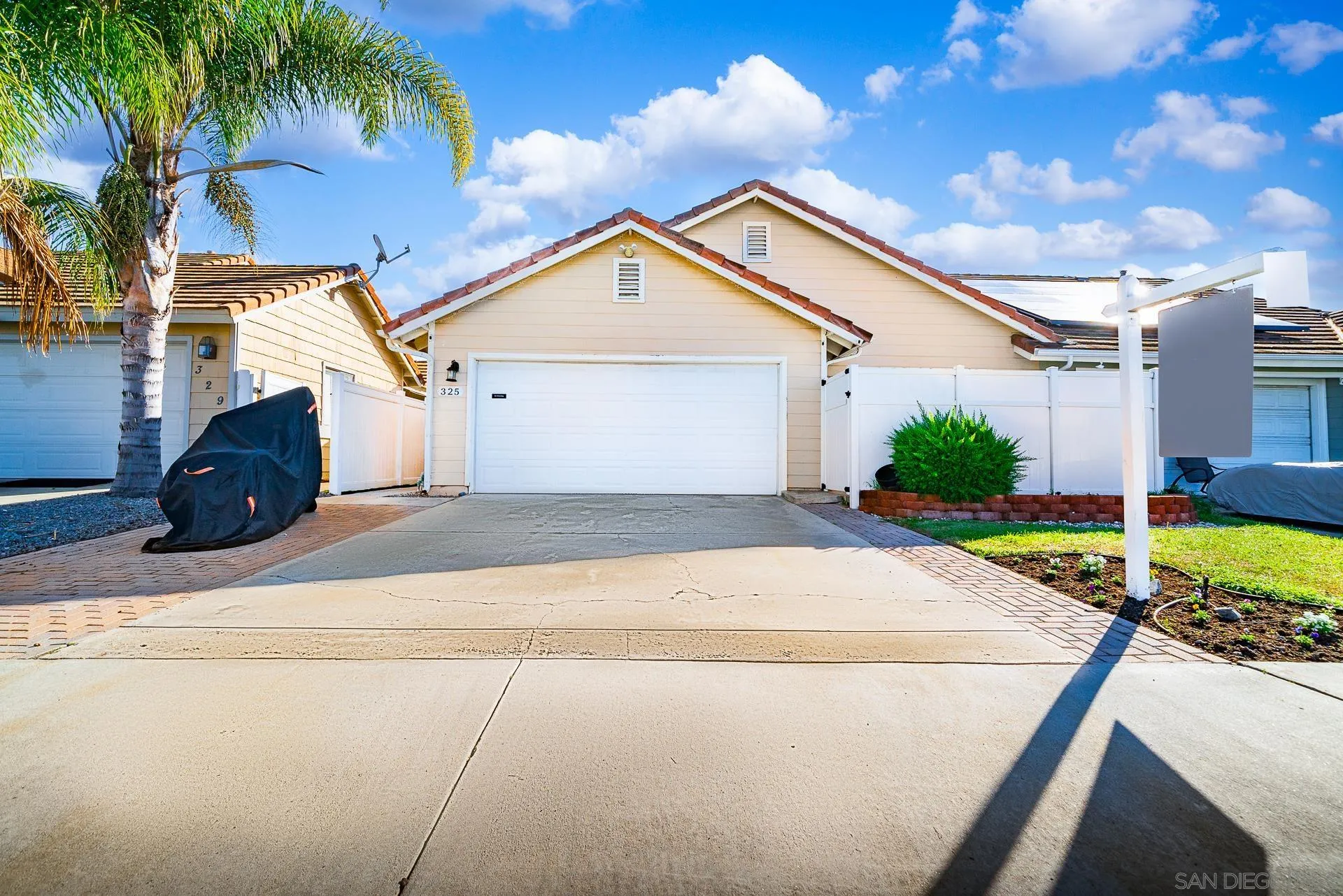 325 Wind Flower Way Oceanside, CA 92057 - Photo 4 of 41 a view of backyard of house and car parked