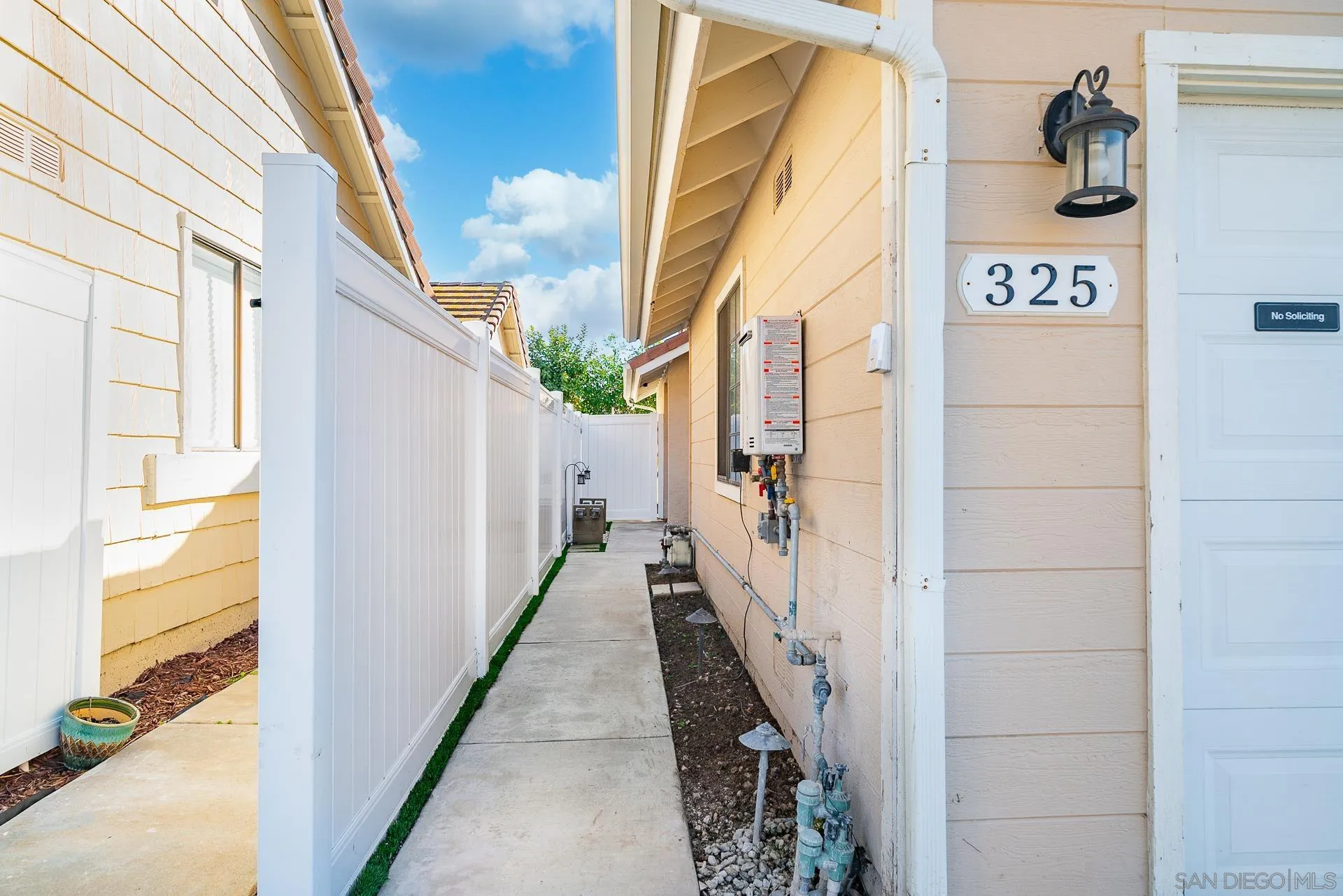 325 Wind Flower Way Oceanside, CA 92057 - Photo 6 of 41 a view of a street with a street sign