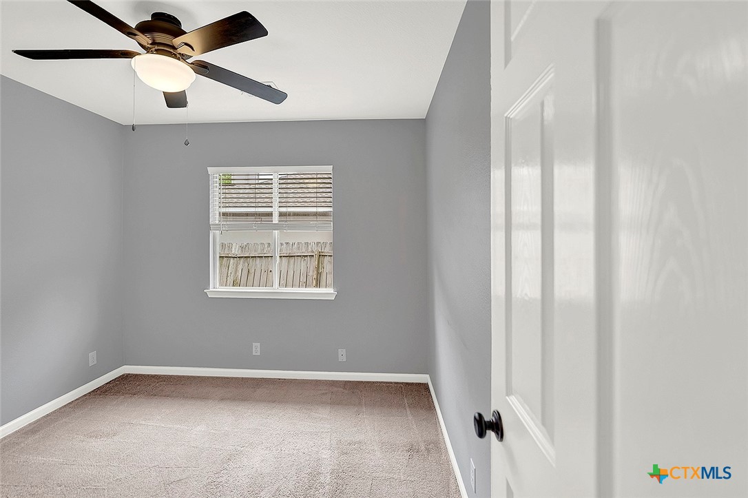 140 Riley Cove Kyle, TX 78640 - Photo 19 of 26 a view of an empty room with a window