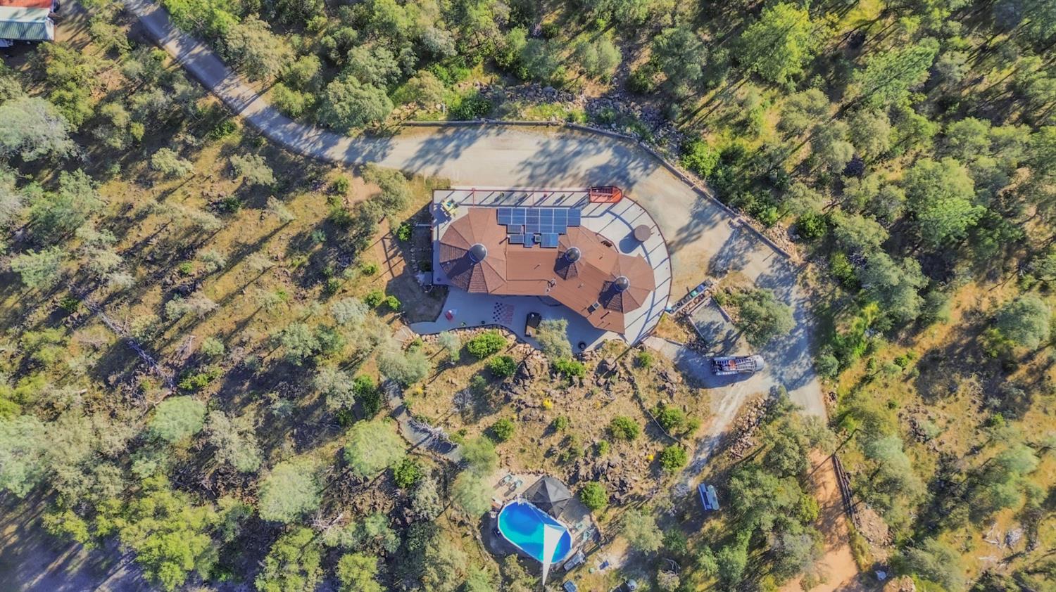 12767 Newtown Road Nevada City, CA 95959 - Photo 48 of 57 a aerial view of a house with a yard and garden