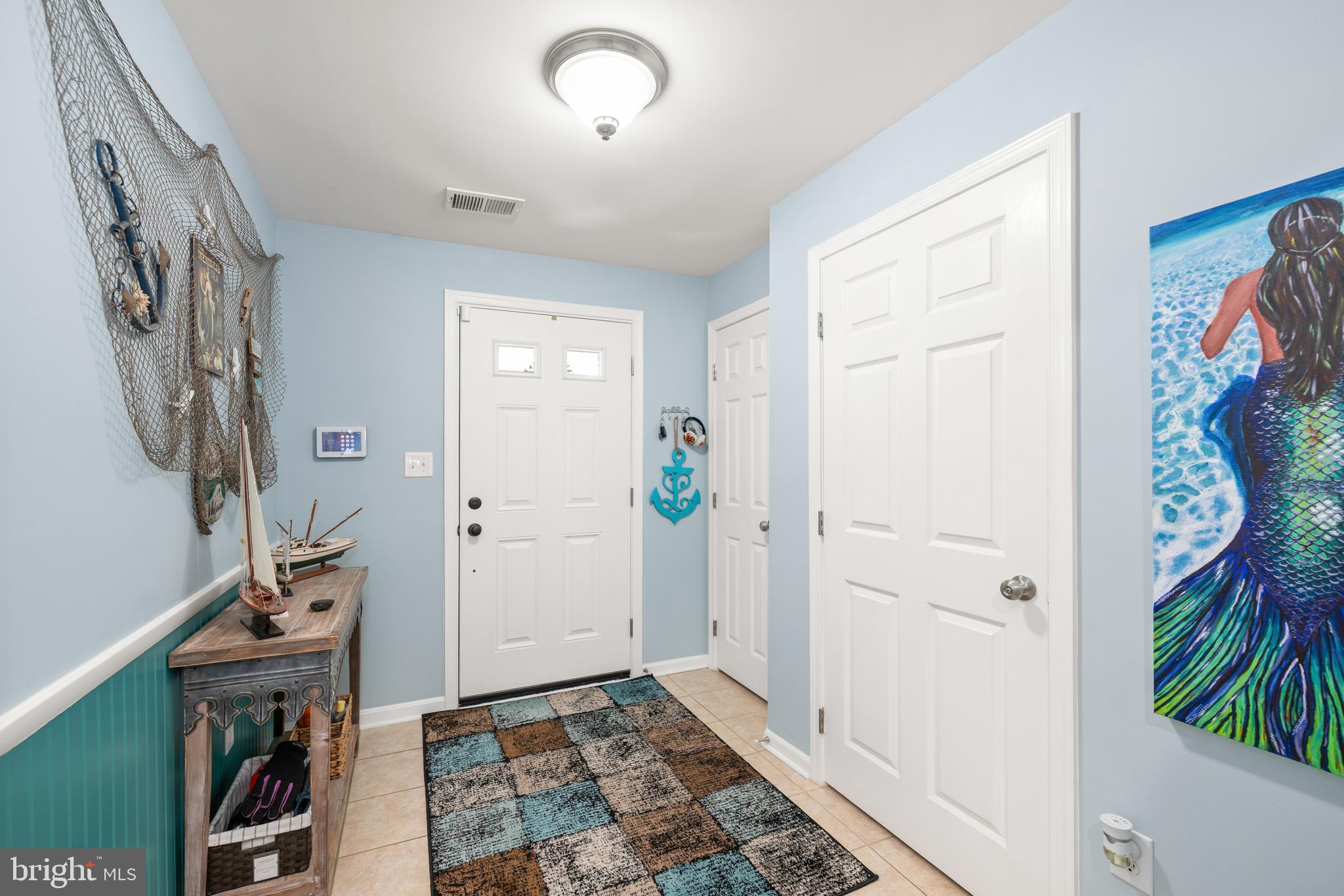 27548 Mayfield Road, Unit 42 Millsboro, DE 19966 - Photo 4 of 46 a view of a hallway with wooden floor and closet