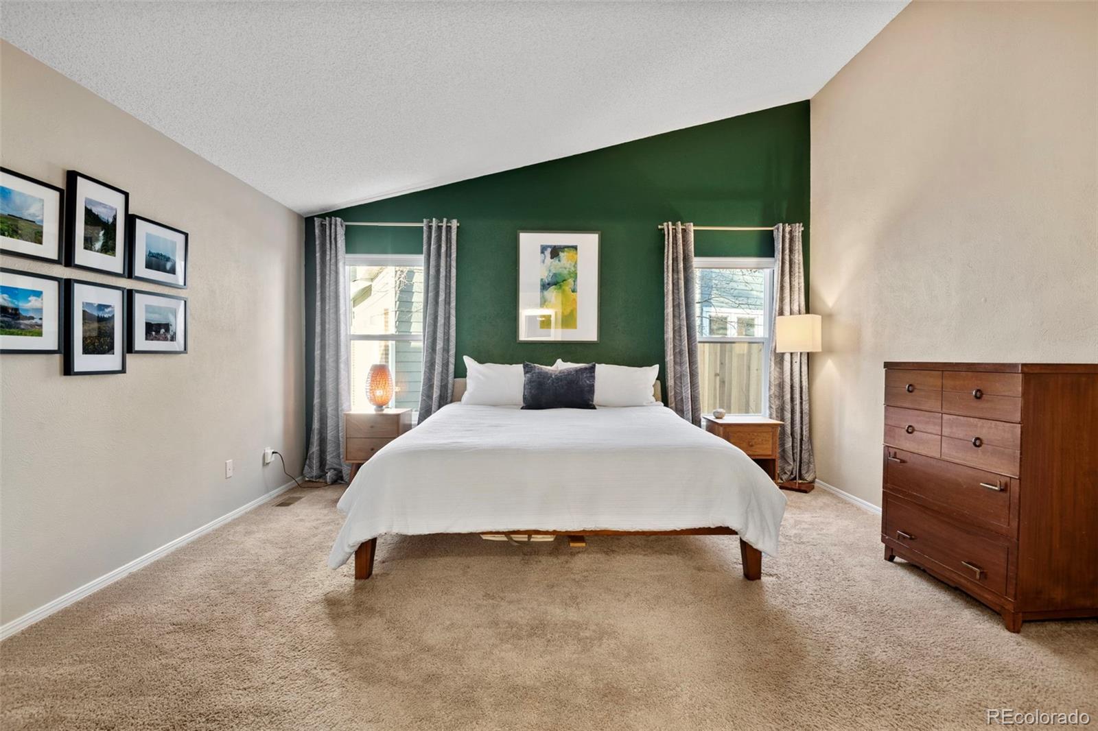 8482 Oak Street Arvada, CO 80005 - Photo 17 of 34 a bedroom with a bed and a television