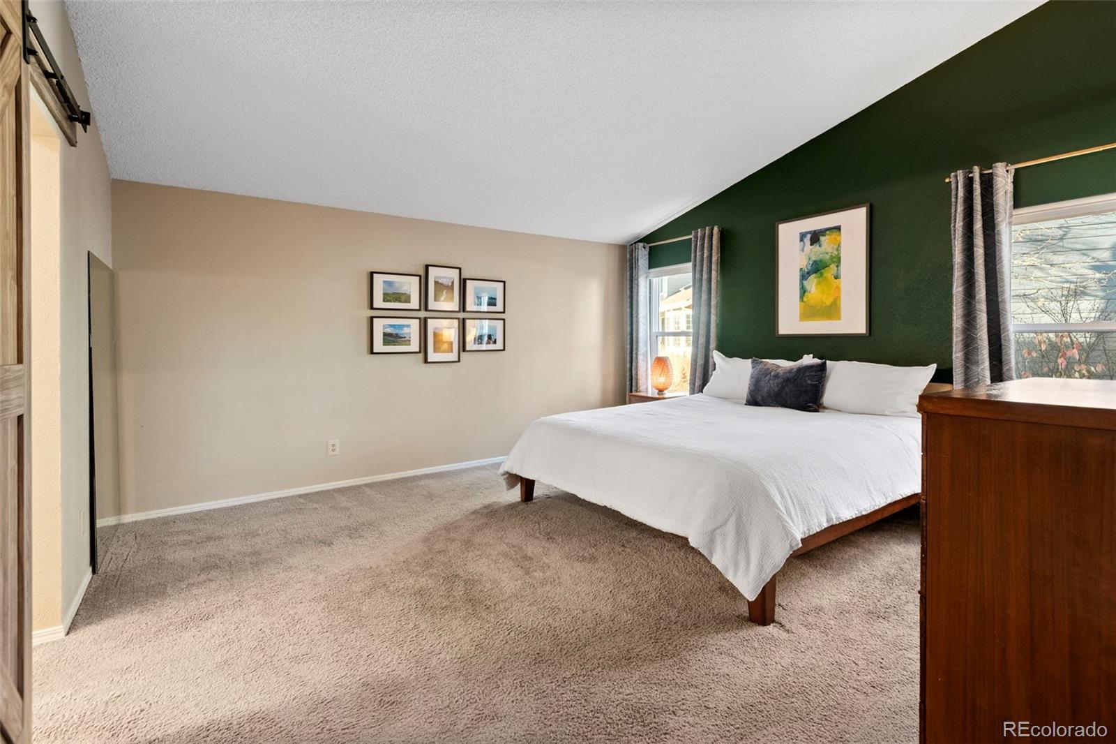 8482 Oak Street Arvada, CO 80005 - Photo 18 of 34 a bedroom with a bed and a window