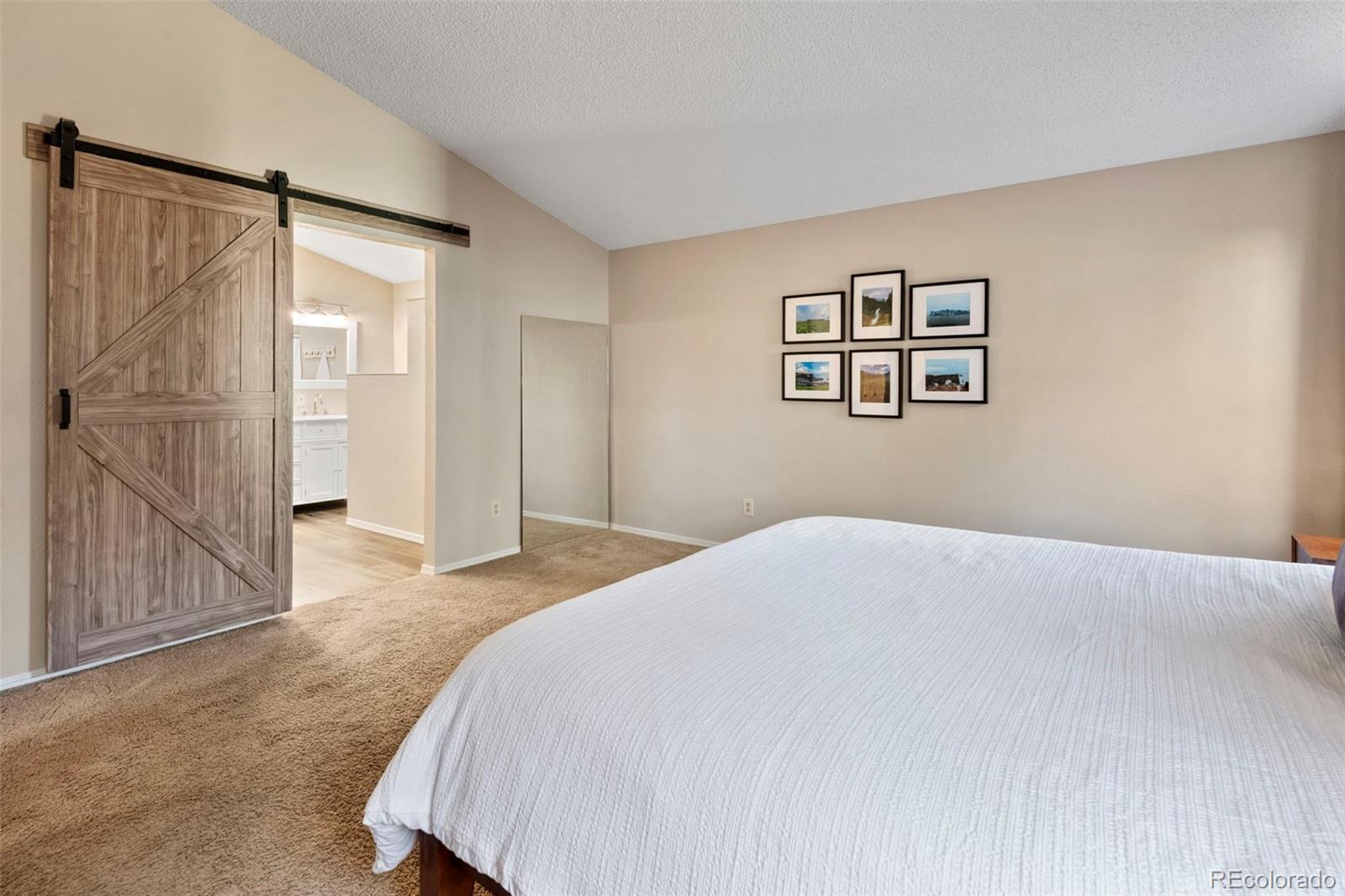 8482 Oak Street Arvada, CO 80005 - Photo 19 of 34 a bedroom with a bed and a window
