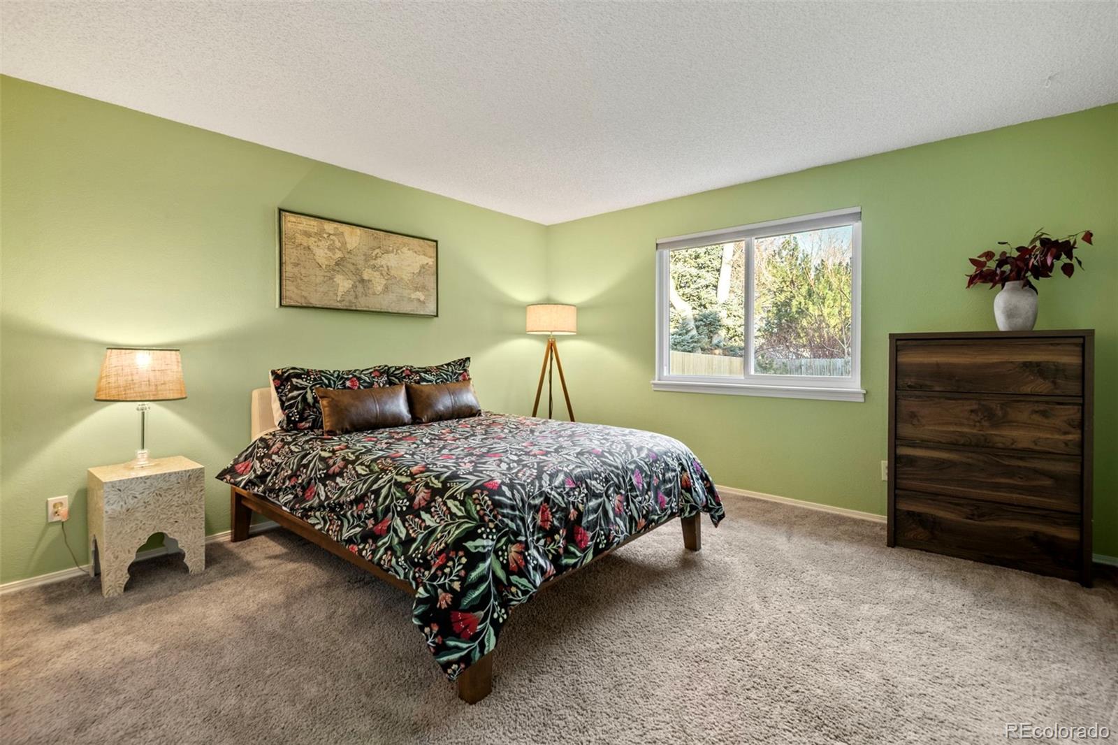 8482 Oak Street Arvada, CO 80005 - Photo 22 of 34 a bedroom with a bed and a closet