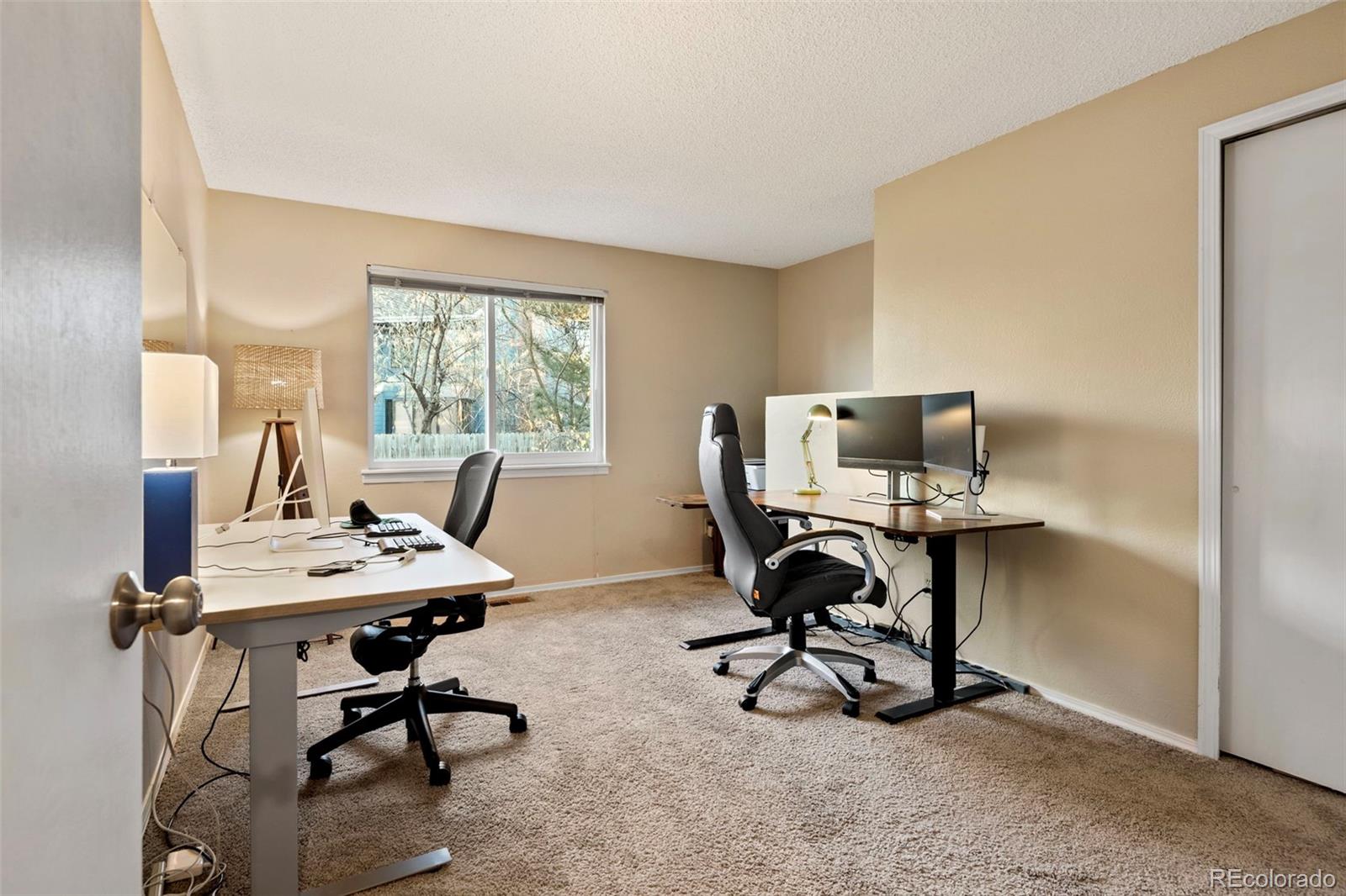 8482 Oak Street Arvada, CO 80005 - Photo 24 of 34 a view of a workspace with furniture and a window