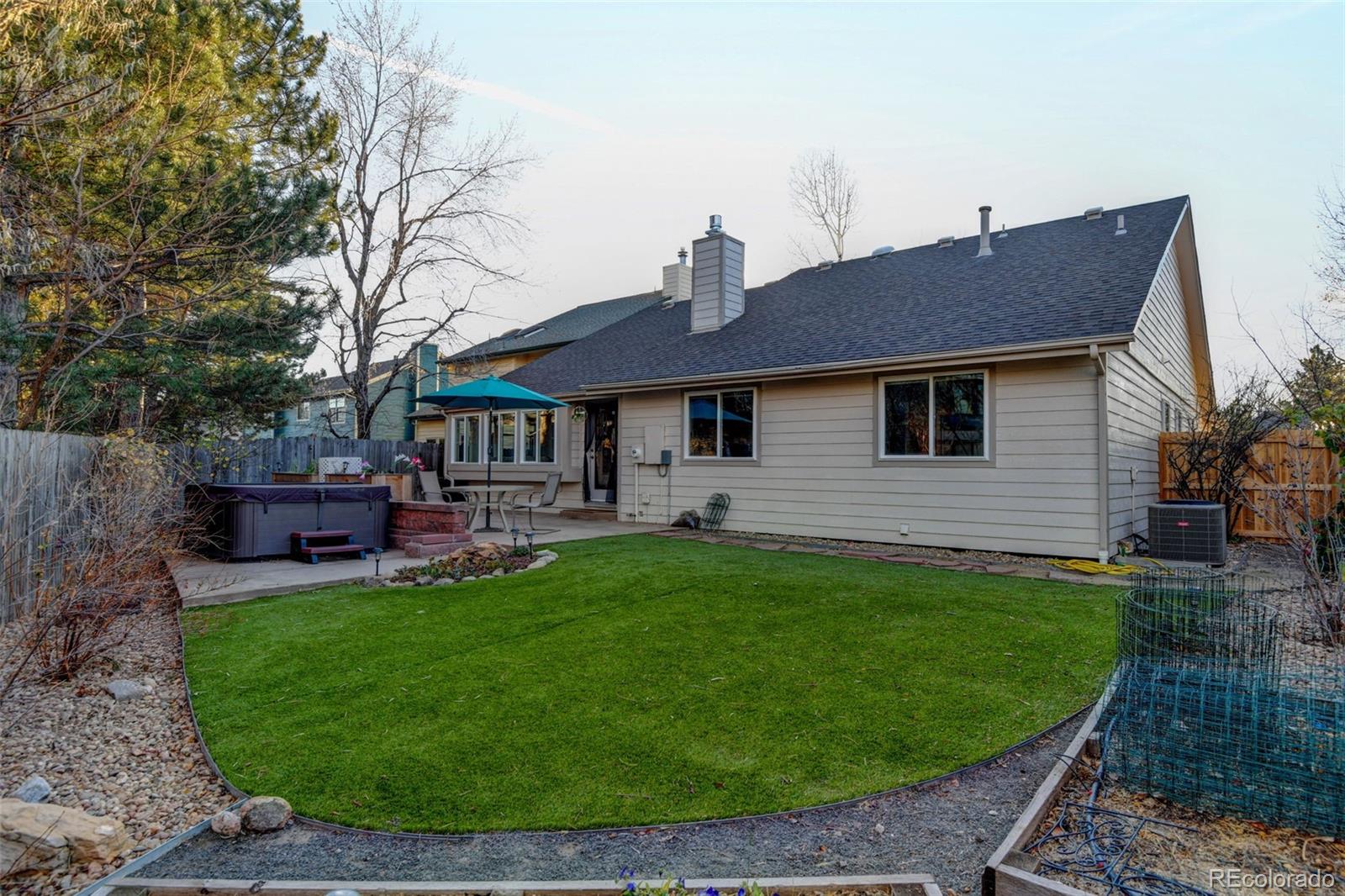 8482 Oak Street Arvada, CO 80005 - Photo 26 of 34 a view of a house with a backyard