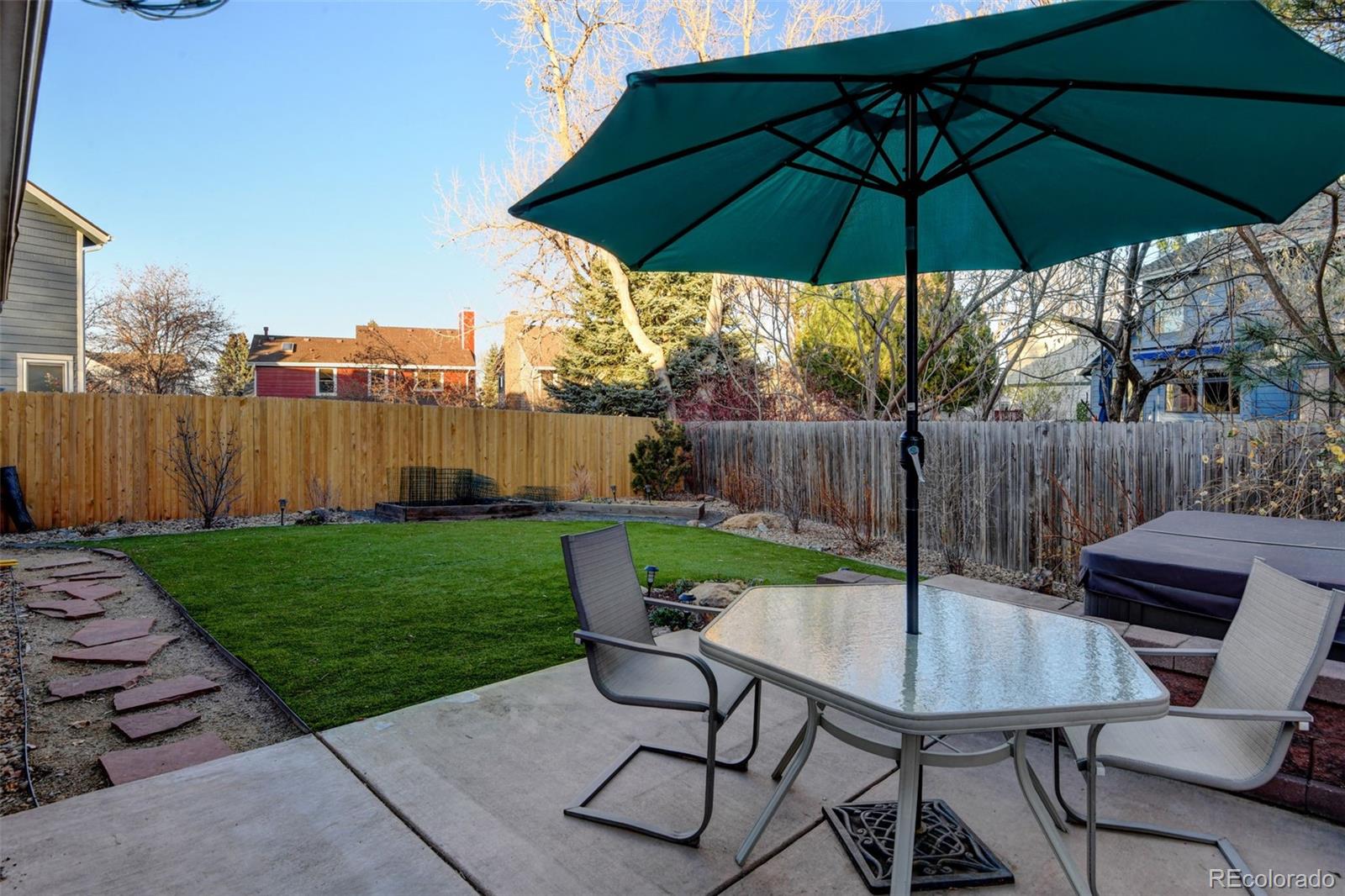 8482 Oak Street Arvada, CO 80005 - Photo 27 of 34 a view of a backyard with furniture and yard