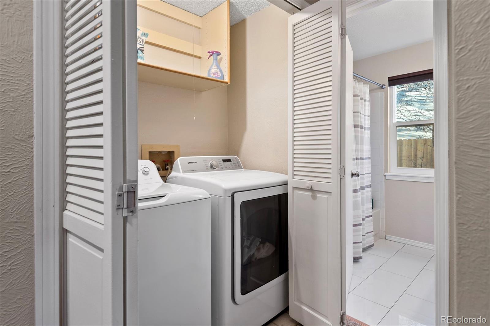 8482 Oak Street Arvada, CO 80005 - Photo 33 of 34 a utility room with dryer and washer