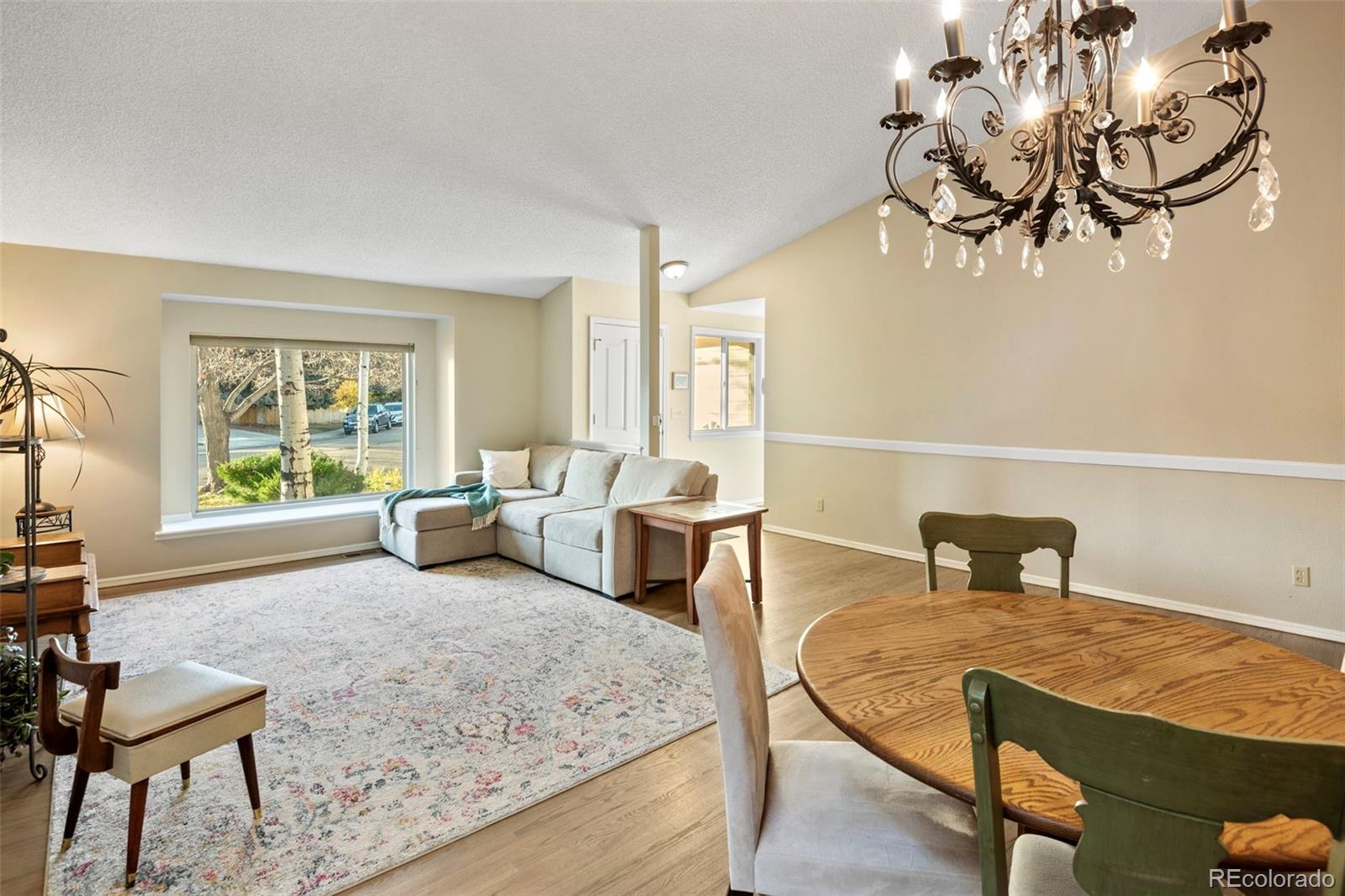 8482 Oak Street Arvada, CO 80005 - Photo 7 of 34 a living room with furniture and a window