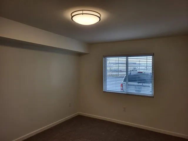 an empty room with a empty space and window