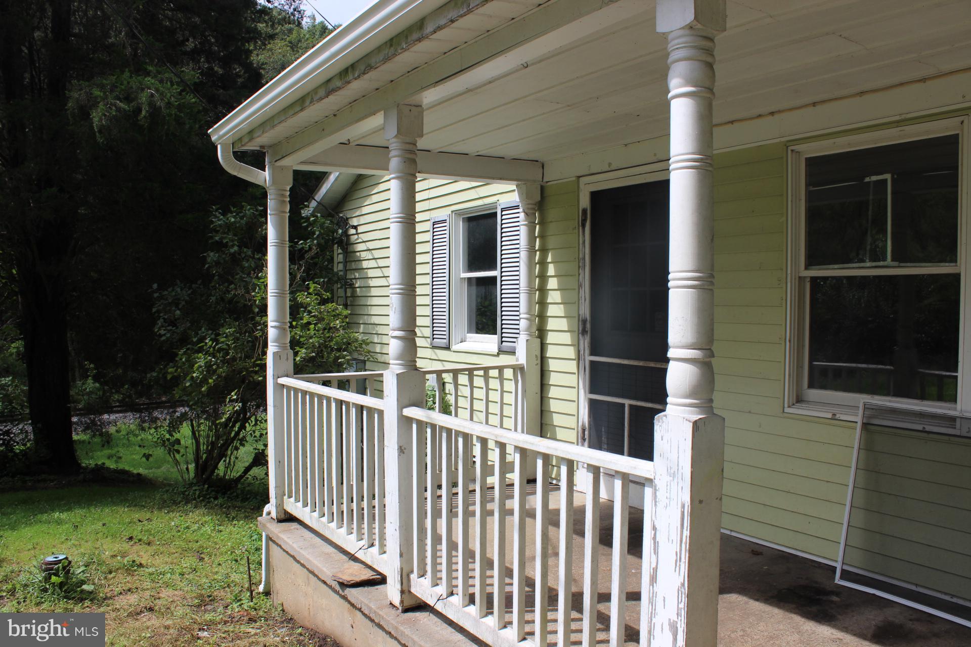 1556 Tank Road Finksburg, MD 21048 - Photo 4 of 12 a view of a house with backyard and porch