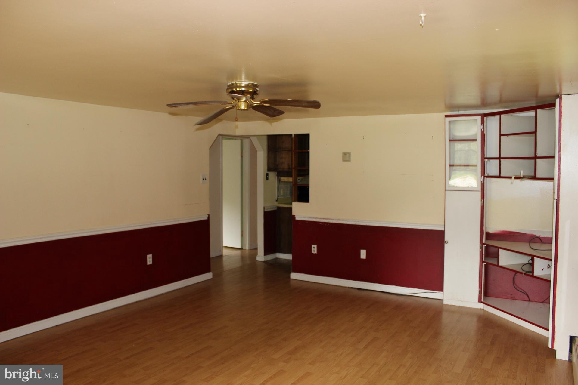 1556 Tank Road Finksburg, MD 21048 - Photo 7 of 12 an empty room with windows and cabinet
