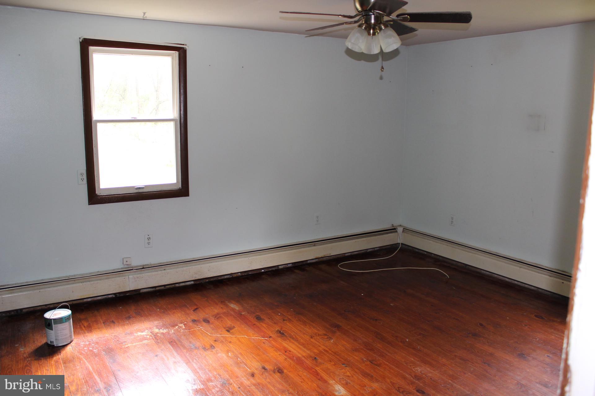 1556 Tank Road Finksburg, MD 21048 - Photo 9 of 12 a view of a room with wooden floor and a window