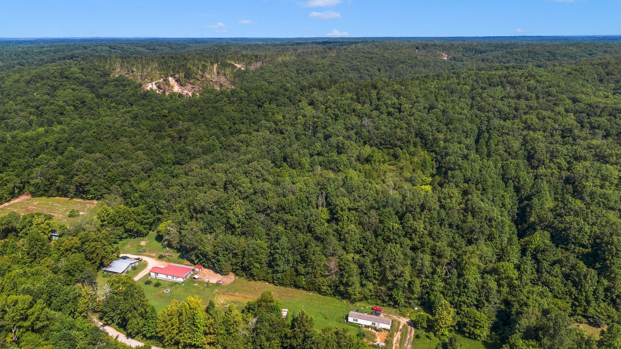 a backyard of a house with lots of green space