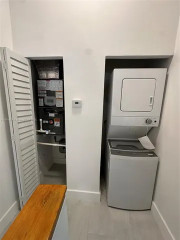 a utility room with washer and dryer