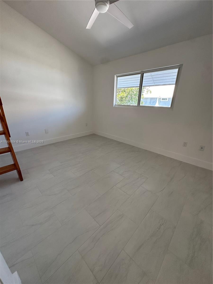 798 Crandon Boulevard, Unit 38C Key Biscayne, FL 33149 - Photo 23 of 33 an empty room with windows