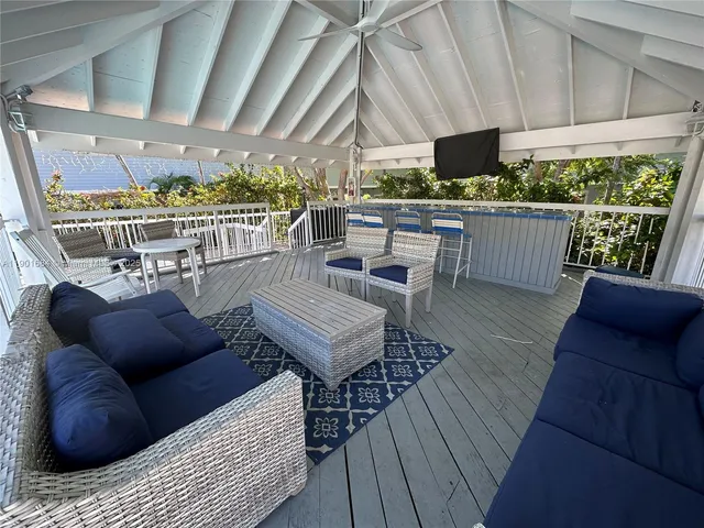 a view of a chairs and tables in patio