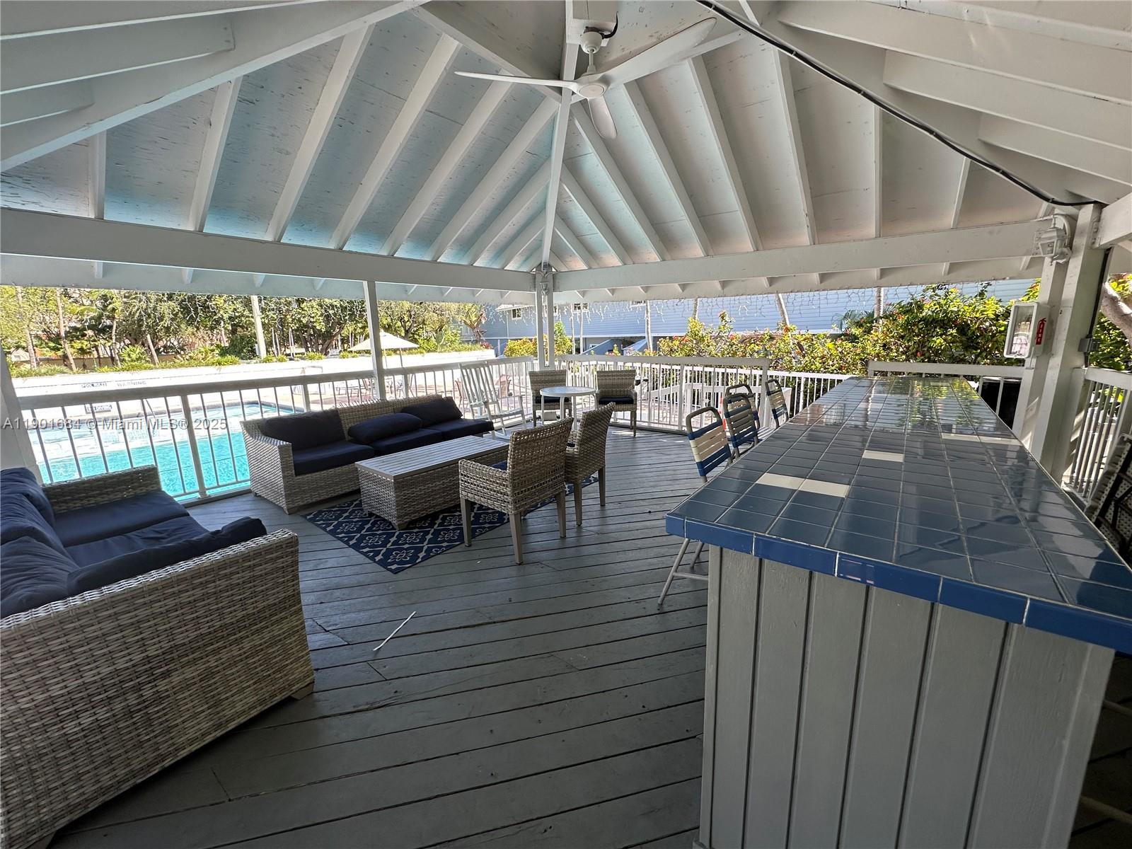 798 Crandon Boulevard, Unit 38C Key Biscayne, FL 33149 - Photo 33 of 33 a view of a chairs and tables in patio